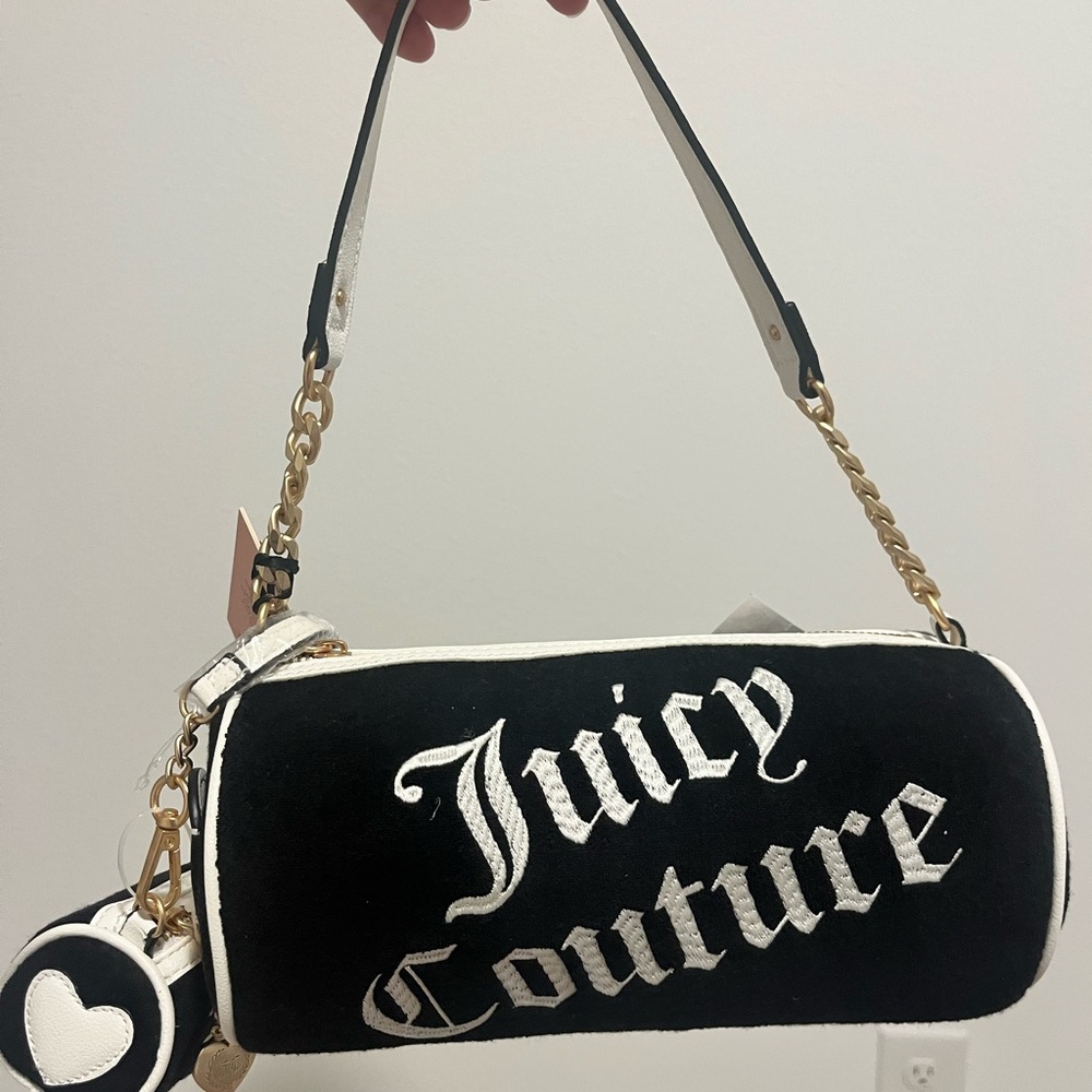Juicy Couture Barrel Purse with mini bag charm.

Liquorice / angel New With Tag